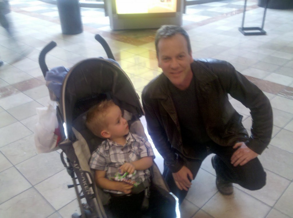 Kiefer Sutherland posing with a baby