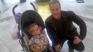 Kiefer Sutherland posing with a baby