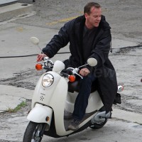 Kiefer Sutherland riding scooter behind the scenes