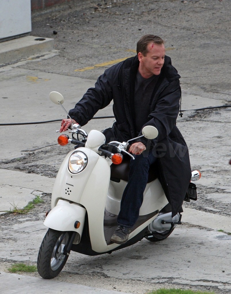 Kiefer Sutherland riding scooter behind the scenes