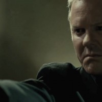 Kiefer Sutherland in The Confession pointing gun
