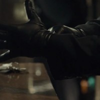 Kiefer Sutherland in The Confession putting on gloves