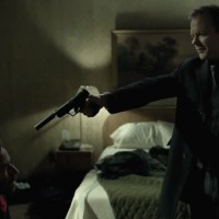 Kiefer Sutherland in The Confession pointing gun