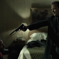 Kiefer Sutherland in The Confession pointing gun