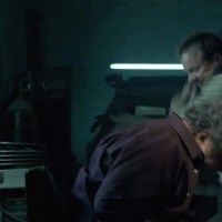 Kiefer Sutherland in The Confession beating guy