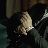 Kiefer Sutherland in The Confession handcuffs