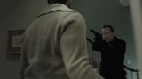 Kiefer Sutherland in The Confession pointing gun