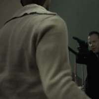 Kiefer Sutherland in The Confession pointing gun