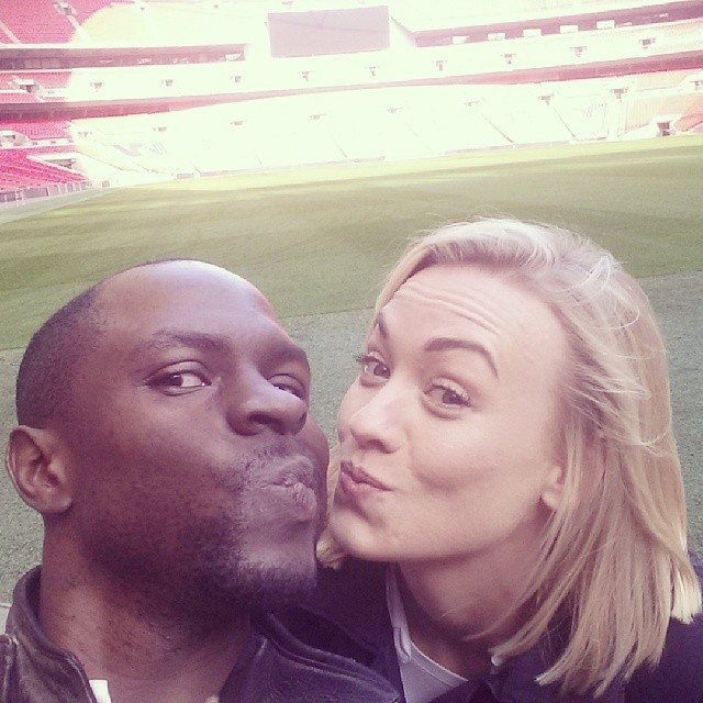 Gbenga Akinnagbe and Yvonne Strahovski goof off while filming 24: Live Another Day at Wembley Stadium