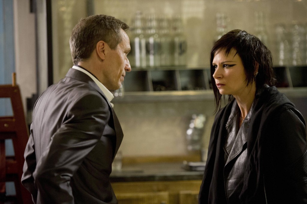Chloe (Mary Lynn Rajskub) needs an explanation from Adrian Cross (Michael Wincott) in 24: Live Another Day Episode 10