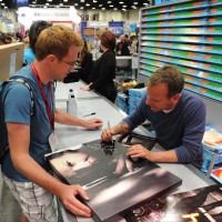 Kiefer Sutherland signing posters at San Diego Comic-Con 2014